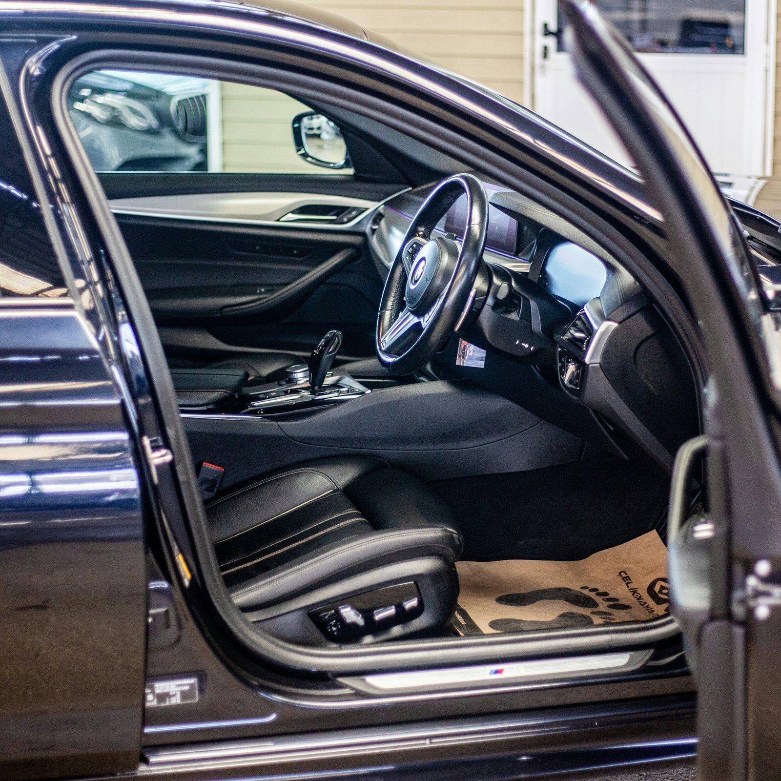 the interior of a car with the door open